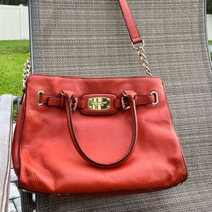 GUC Michael Kors Orange Purse with gold details on shoulder strap